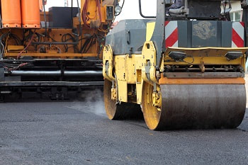heavy equipment needed for asphalt parking lot paving