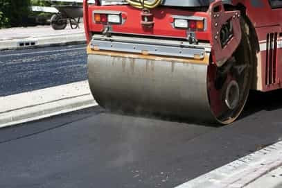 asphalt parking lot in the process of being paved